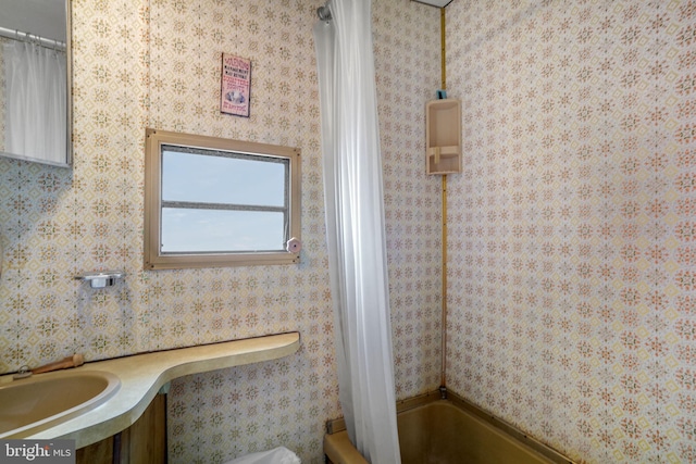 8096 Mire Pond One, Chincoteague Island, VA 23336 - bathroom featuring shower / tub combo with curtain and vanity