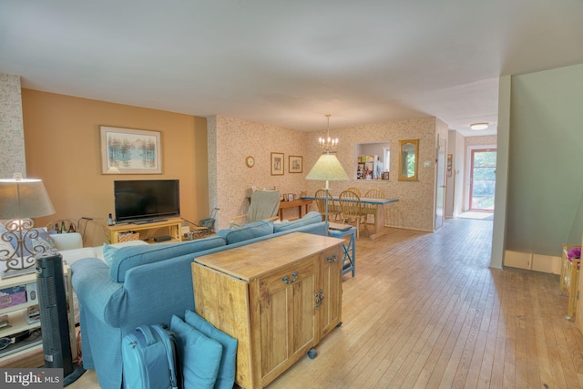 60 Jones Valley Cir, Baltimore, MD 21209 - living room featuring wallpapered walls, light wood finished floors, and a chandelier