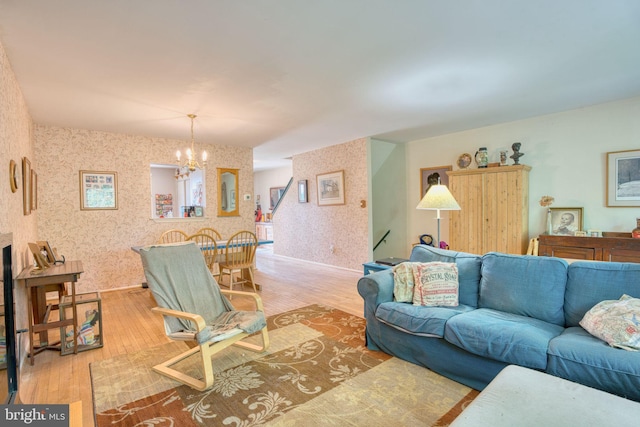 60 Jones Valley Cir, Baltimore, MD 21209 - living area featuring wallpapered walls, a chandelier, and light wood-type flooring