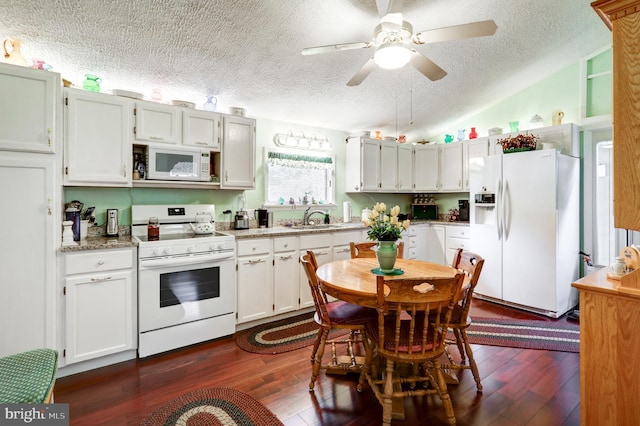 1534 Benton Hollow Rd, Drumore, PA 17518 - kitchen with white appliances, a textured ceiling, ceiling fan, dark wood-style flooring, and vaulted ceiling