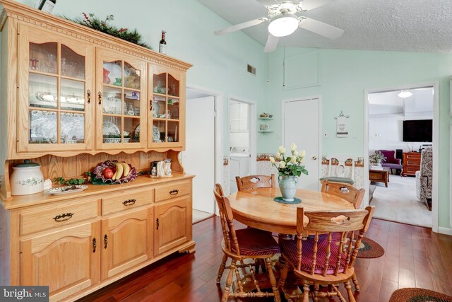 1534 Benton Hollow Rd, Drumore, PA 17518 - dining space with independent washer and dryer, dark wood-type flooring, ceiling fan, and high vaulted ceiling