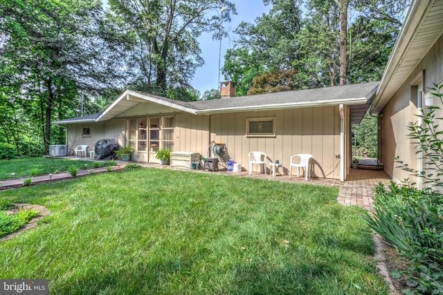 1534 Benton Hollow Rd, Drumore, PA 17518 - back of property featuring a lawn and a chimney