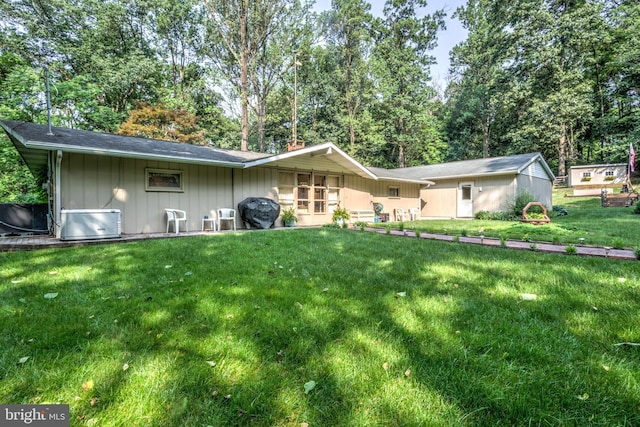 1534 Benton Hollow Rd, Drumore, PA 17518 - rear view of house with a yard and board and batten siding