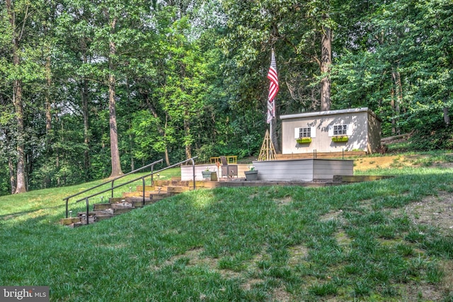 1534 Benton Hollow Rd, Drumore, PA 17518 - view of grassy yard featuring an outbuilding, stairs, a wooded view, and a deck