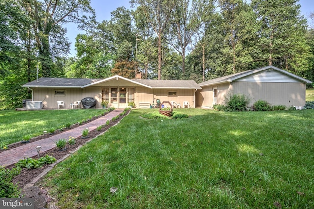 1534 Benton Hollow Rd, Drumore, PA 17518 - view of front facade featuring a front lawn, a chimney, and view of scattered trees