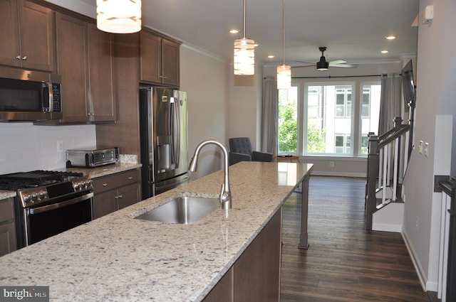 16150 Bowery St, Rockville, MD 20855 - kitchen featuring appliances with stainless steel finishes, a sink, ornamental molding, dark wood-type flooring, and baseboards