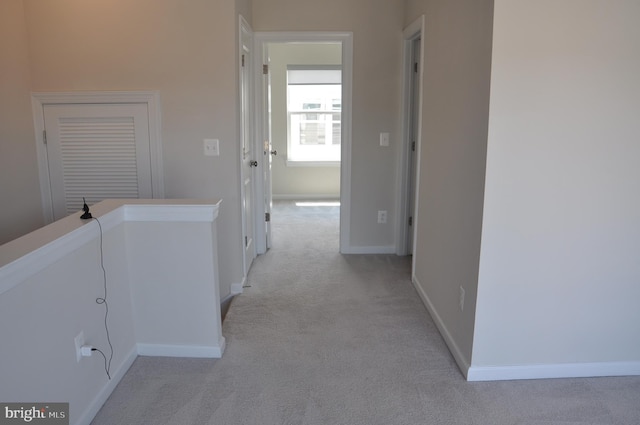 16150 Bowery St, Rockville, MD 20855 - hallway with light colored carpet, baseboards, and an upstairs landing