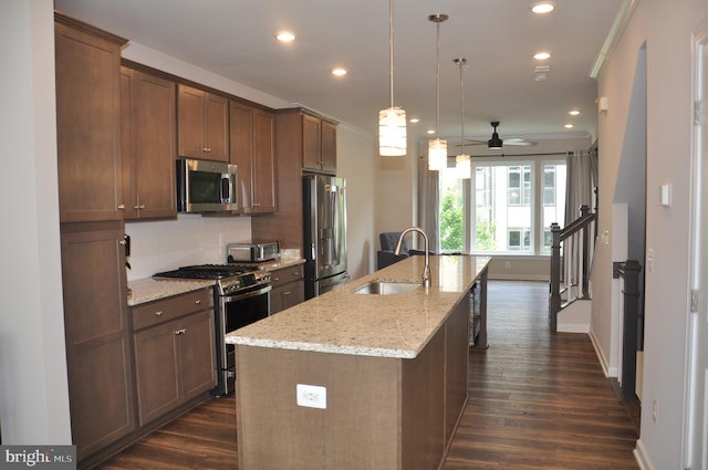 16150 Bowery St, Rockville, MD 20855 - kitchen with appliances with stainless steel finishes, a sink, a ceiling fan, an island with sink, and dark wood-type flooring