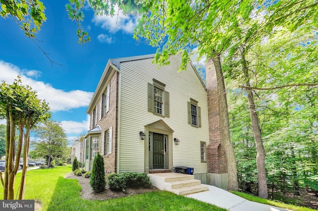 8102 Aspenwood Way, Jessup, MD 20794 - view of front of home with a front yard and a chimney