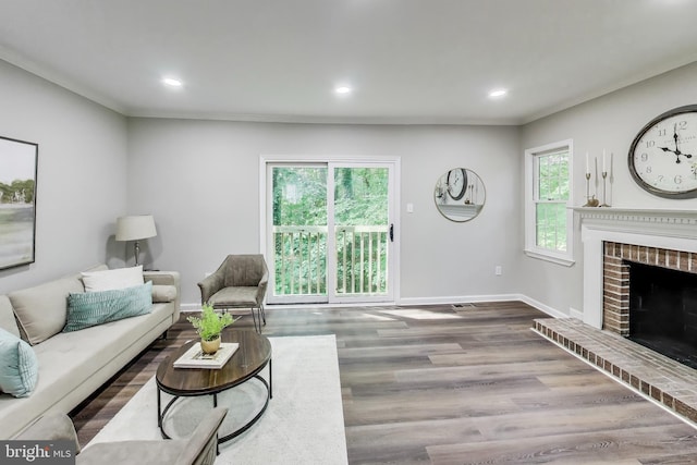 8102 Aspenwood Way, Jessup, MD 20794 - living area featuring wood finished floors, recessed lighting, a fireplace, and ornamental molding