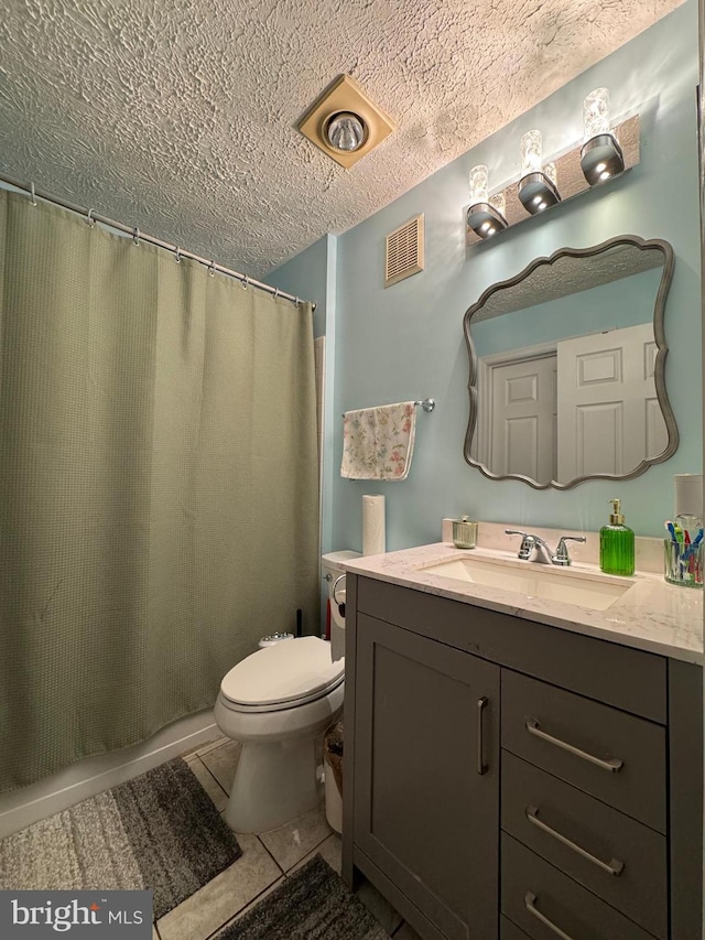 3712 Excalibur Ct Unit 202, Bowie, MD 20716 - full bath with vanity, toilet, a textured ceiling, tile patterned floors, and a shower with curtain