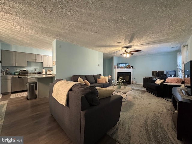 3712 Excalibur Ct Unit 202, Bowie, MD 20716 - living area with a ceiling fan, dark wood-style floors, a textured ceiling, and a fireplace