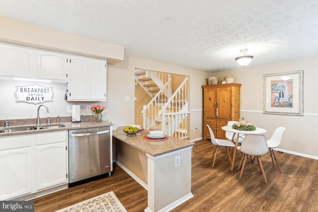 1646 Sierra Woods Dr, Reston, VA 20194 - kitchen featuring dishwasher, a sink, a peninsula, dark wood-style floors, and white cabinets