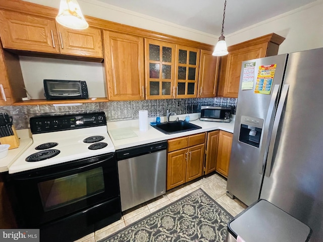 46 Township Line Rd Unit 215, Elkins Park, PA 19027 - kitchen with appliances with stainless steel finishes, a sink, light countertops, brown cabinets, and tasteful backsplash
