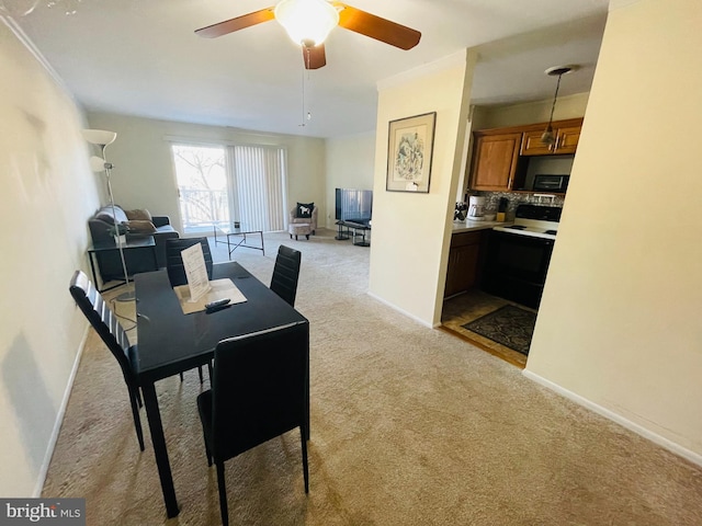 46 Township Line Rd Unit 215, Elkins Park, PA 19027 - dining space featuring light carpet, baseboards, and ceiling fan