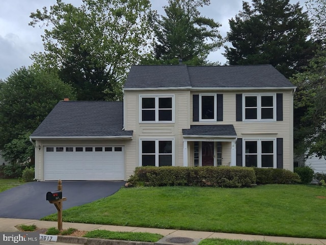 13617 Union Village Cir, Clifton, VA 20124 - traditional-style house featuring driveway, an attached garage, a front lawn, and roof with shingles
