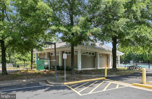 13617 Union Village Cir, Clifton, VA 20124 - view of property with uncovered parking and a community pool