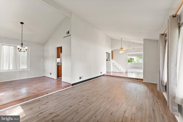 402 Sugarland Run Dr, Sterling, VA 20164 - unfurnished living room with high vaulted ceiling, stairs, wood finished floors, a chandelier, and a ceiling fan