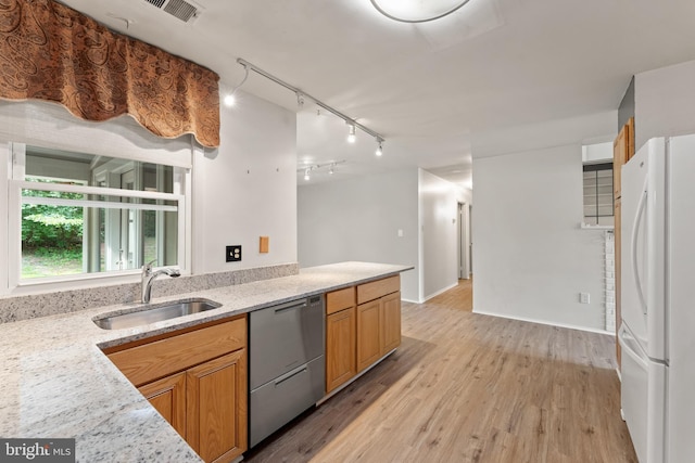 402 Sugarland Run Dr, Sterling, VA 20164 - kitchen featuring freestanding refrigerator, dishwasher, light wood-style floors, rail lighting, and light stone countertops