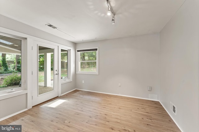 402 Sugarland Run Dr, Sterling, VA 20164 - spare room with light wood-style flooring and rail lighting