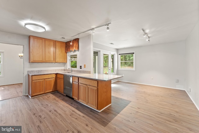 402 Sugarland Run Dr, Sterling, VA 20164 - kitchen featuring stainless steel dishwasher, a peninsula, rail lighting, light wood-type flooring, and open floor plan