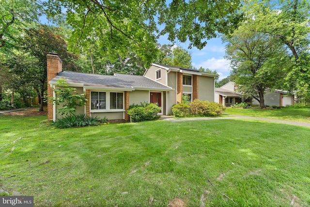402 Sugarland Run Dr, Sterling, VA 20164 - view of front of house with a chimney, a front lawn, and brick siding