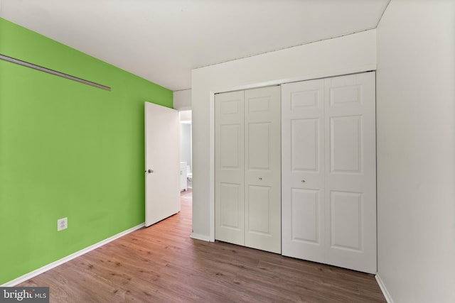 402 Sugarland Run Dr, Sterling, VA 20164 - unfurnished bedroom with wood finished floors and a closet