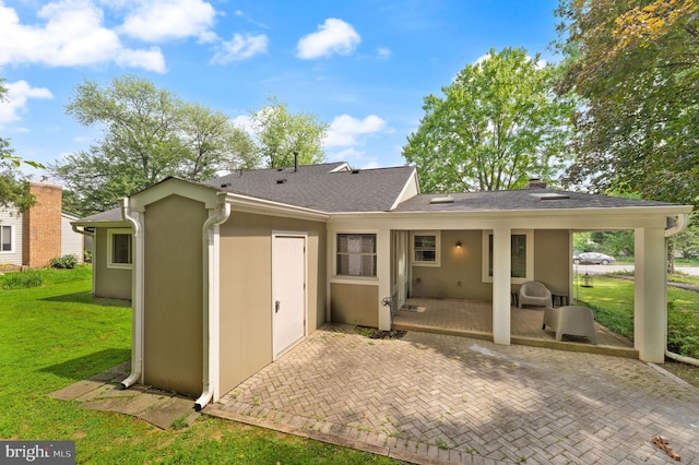 402 Sugarland Run Dr, Sterling, VA 20164 - back of house featuring a patio area, a lawn, roof with shingles, and stucco siding