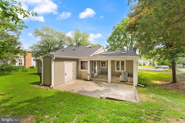 402 Sugarland Run Dr, Sterling, VA 20164 - rear view of house with a patio, a lawn, stucco siding, and a shingled roof
