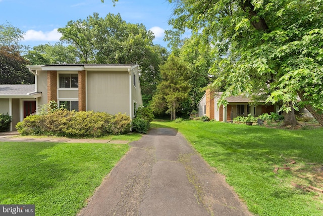 402 Sugarland Run Dr, Sterling, VA 20164 - view of home's exterior featuring asphalt driveway and a yard