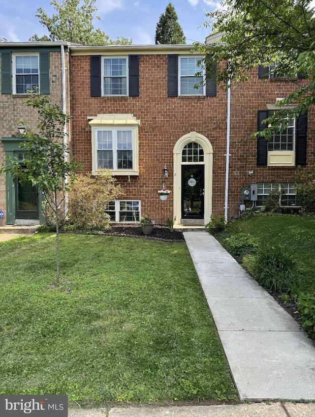 9 Bussing Ct, Lutherville Timonium, MD 21093 - townhome / multi-family property with a front lawn and brick siding