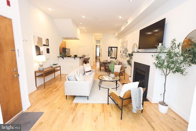 1622 19th St NW Unit 2, Washington, DC 20009 - living area featuring light wood-style flooring, a fireplace, and recessed lighting