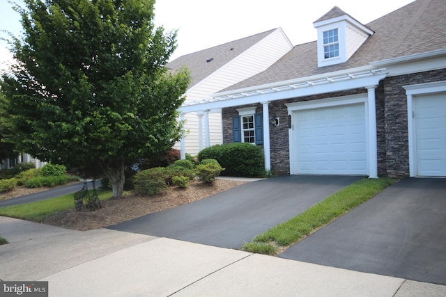 44497 Maltese Falcon Sq, Ashburn, VA 20147 - view of front of property with stone siding, a shingled roof, asphalt driveway, and an attached garage