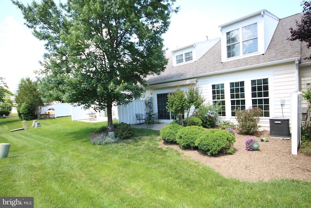 44497 Maltese Falcon Sq, Ashburn, VA 20147 - rear view of house with roof with shingles and a patio