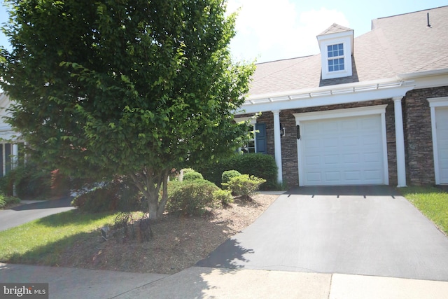 44497 Maltese Falcon Sq, Ashburn, VA 20147 - view of front facade with asphalt driveway, a shingled roof, and a garage