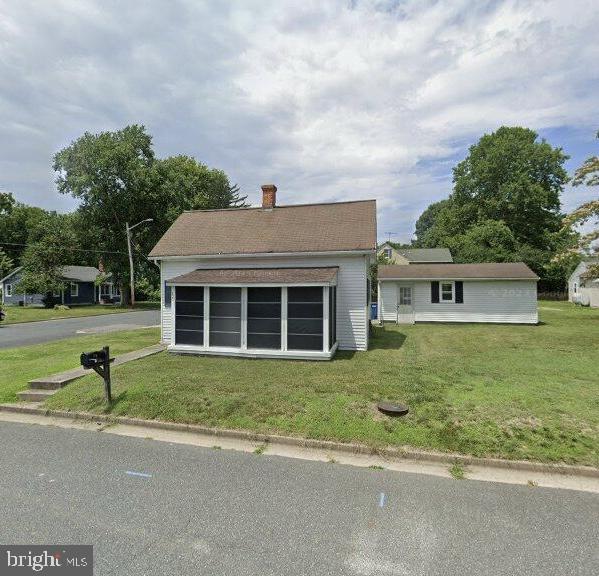 13 Prospect Ave, Easton, MD 21601 - view of front of home featuring a chimney and a front lawn