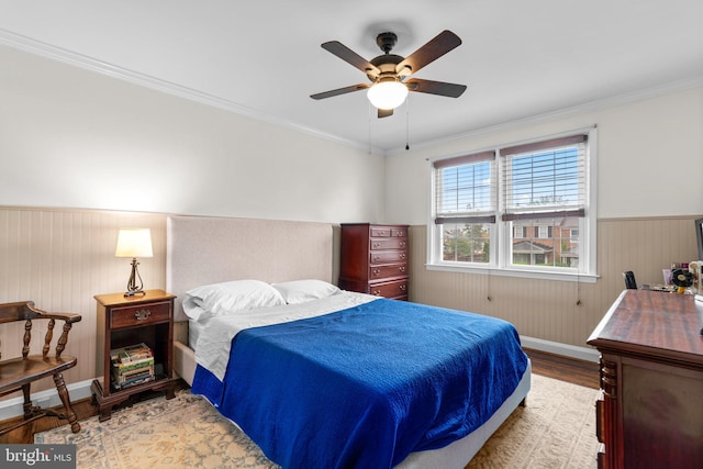 222 Blakeney Rd, Baltimore, MD 21228 - bedroom with wood finished floors, a wainscoted wall, ornamental molding, and ceiling fan