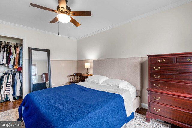 222 Blakeney Rd, Baltimore, MD 21228 - bedroom with wood finished floors, crown molding, ceiling fan, and a closet