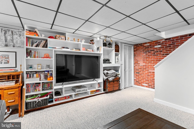 222 Blakeney Rd, Baltimore, MD 21228 - living room with brick wall, carpet floors, and a drop ceiling