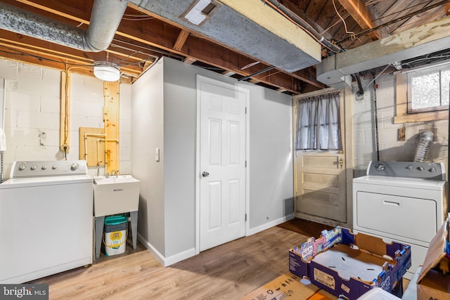 222 Blakeney Rd, Baltimore, MD 21228 - washroom featuring wood finished floors and washer and dryer