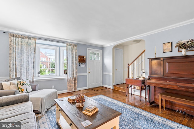 222 Blakeney Rd, Baltimore, MD 21228 - living room with wood finished floors, arched walkways, crown molding, and stairs