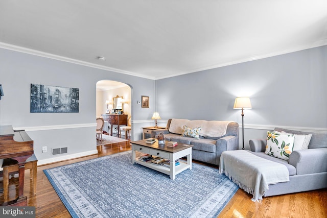 222 Blakeney Rd, Baltimore, MD 21228 - living room with arched walkways, wood finished floors, and crown molding