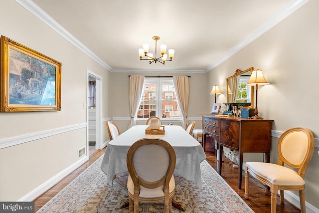 222 Blakeney Rd, Baltimore, MD 21228 - dining space featuring a chandelier, light wood-type flooring, and crown molding