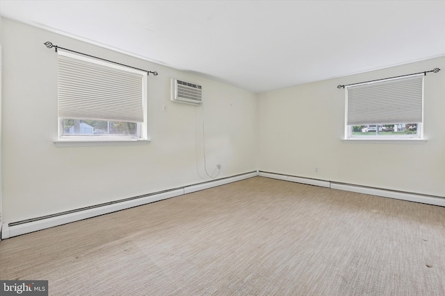 48 Llanfair Rd Unit 1, Ardmore, PA 19003 - unfurnished room featuring healthy amount of natural light, baseboard heating, and an AC wall unit