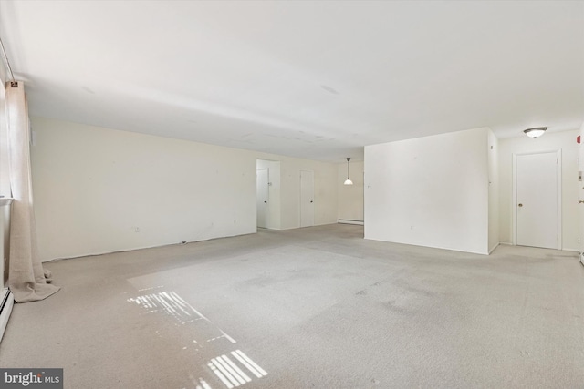 48 Llanfair Rd Unit 1, Ardmore, PA 19003 - spare room featuring light colored carpet and a baseboard heating unit