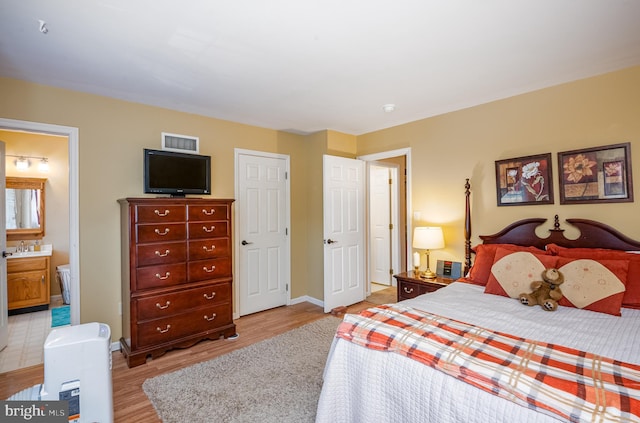 1043 Fredrick Blvd, Reading, PA 19605 - bedroom with light wood-style floors and ensuite bathroom