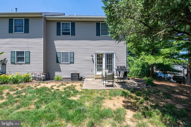 1043 Fredrick Blvd, Reading, PA 19605 - rear view of house featuring a patio and a yard