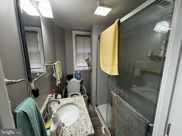 3236 George St, Baltimore, MD 21220 - full bath with a stall shower, wood finished floors, and vanity