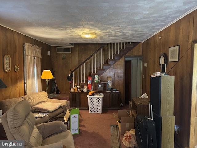 3236 George St, Baltimore, MD 21220 - carpeted living area featuring wooden walls and stairway