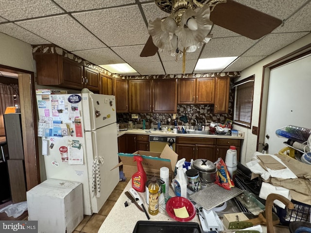 3236 George St, Baltimore, MD 21220 - kitchen with freestanding refrigerator, a drop ceiling, dishwashing machine, light countertops, and light tile patterned floors